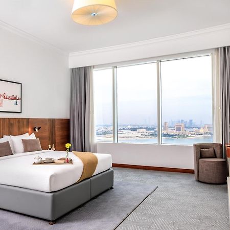 Somerset West Bay Doha Exteriör bild A bedroom at the hotel