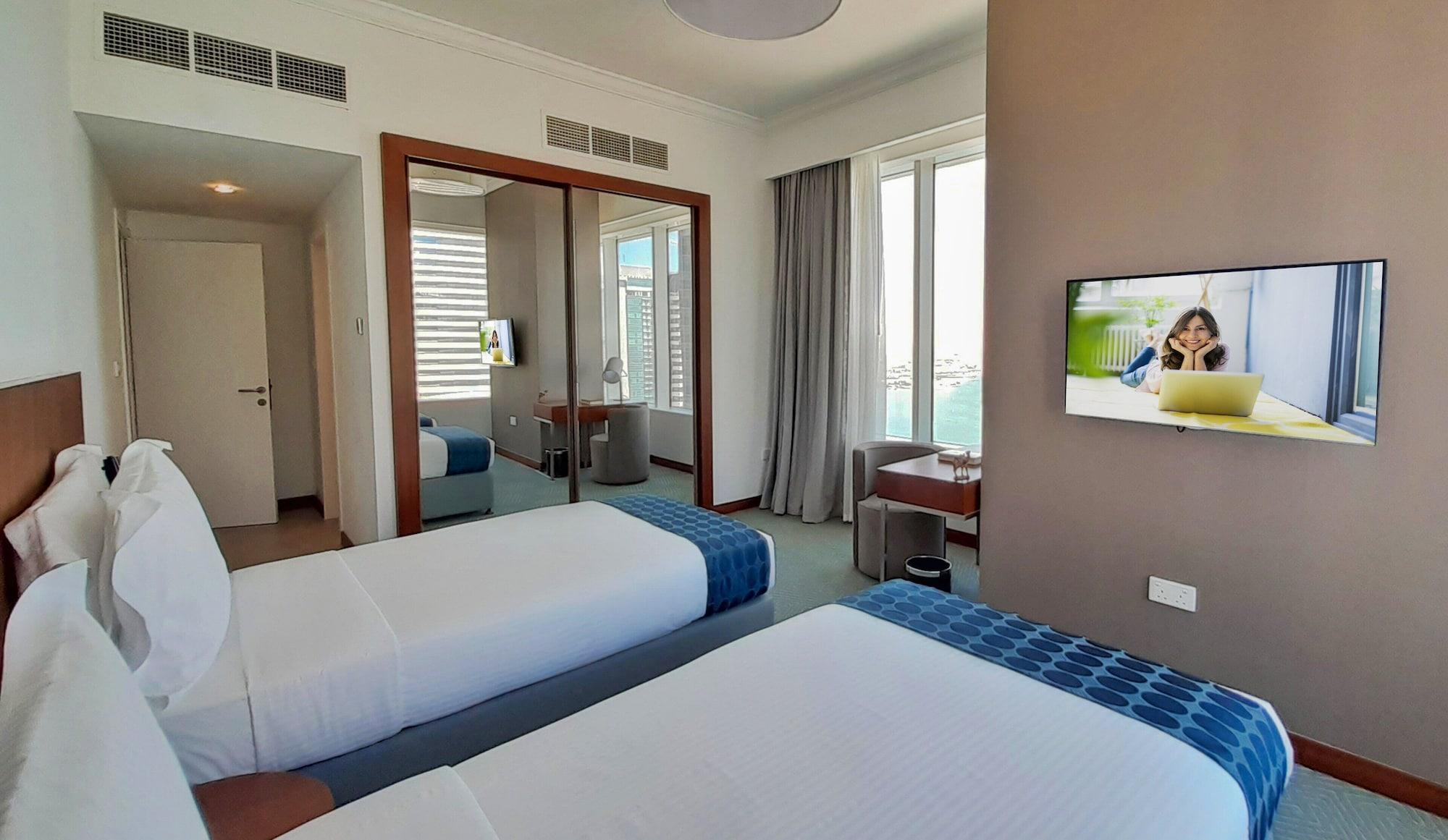 Somerset West Bay Doha Exteriör bild A bedroom at the hotel